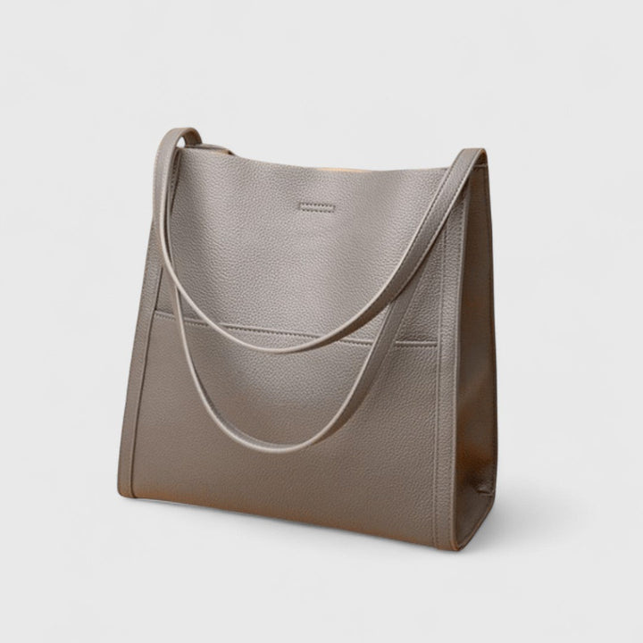 Plousia - Bolso de hombro de piel con un diseño sencillo y elegante