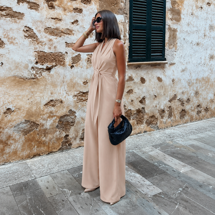 Alba - Mono halter con escote en V y lazo en la cintura