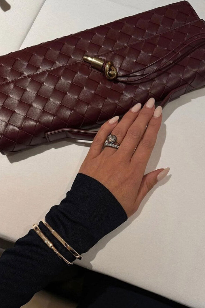 Bolso de mano Melanie con detalle de nudo dorado