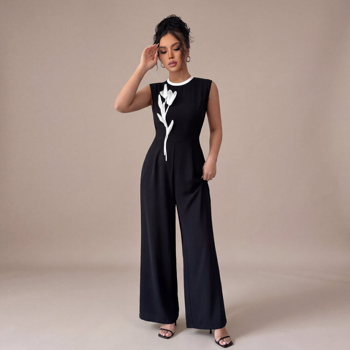 Iria – mono negro con detalle floral en contraste